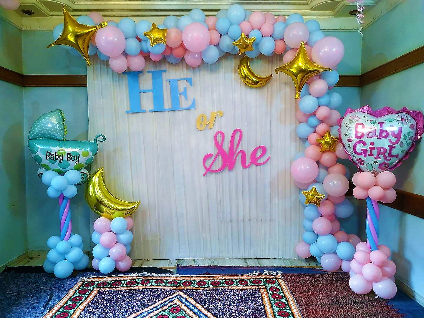Clothed backdrop with pastel color balloons with 2 columns with foil