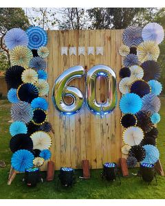 Wooden frame backdrop with paper fan arrangement