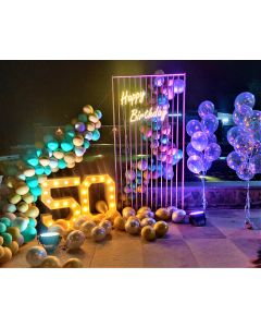 Balloon structurewith number 50 with happy birthday neon light and balloon bunches