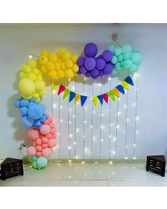 Simple home décor with mirchi lights background and pastel organic arch